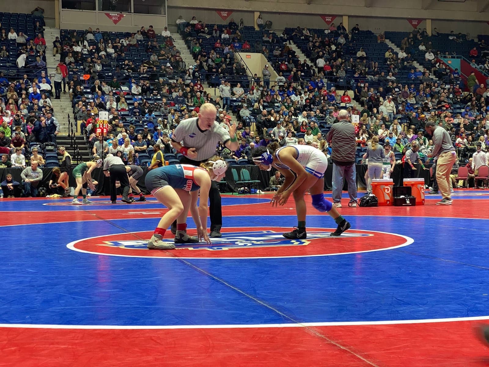 Peachtree Ridge wrestlers competing on the mat